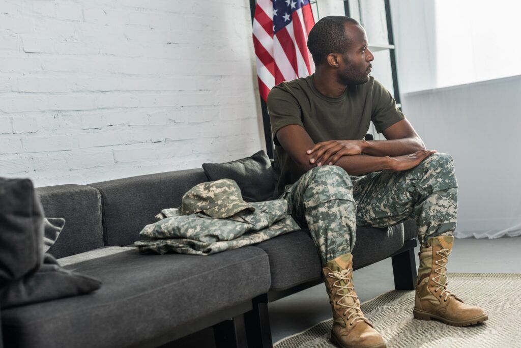 A veteran, who is suffering from drug abuse, near an American flag