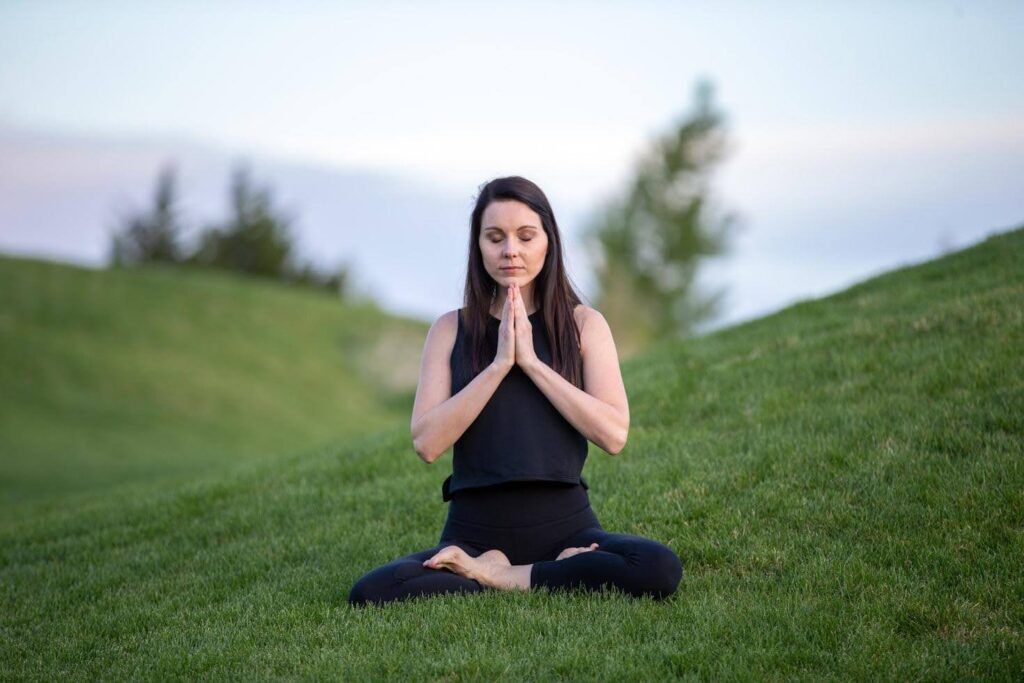 woman doing yoga to cope with PTSD