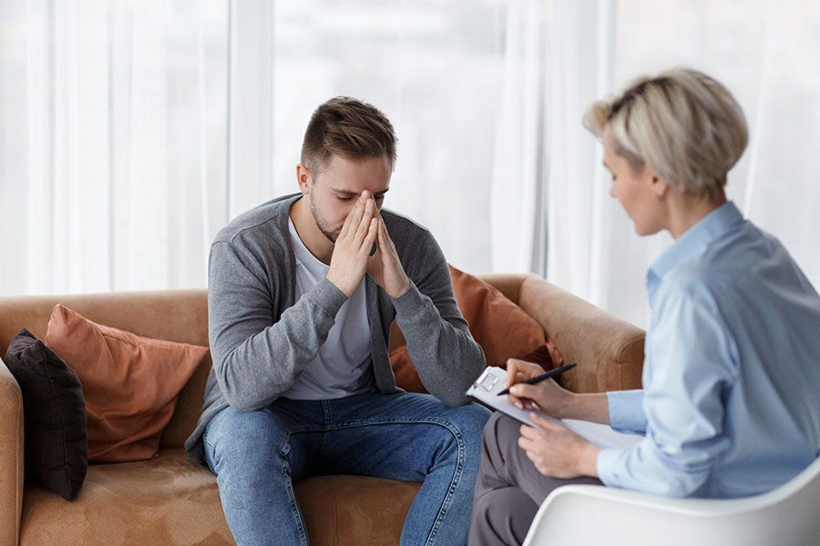 Adult man undegoing psychotherapy session to control anxiety.