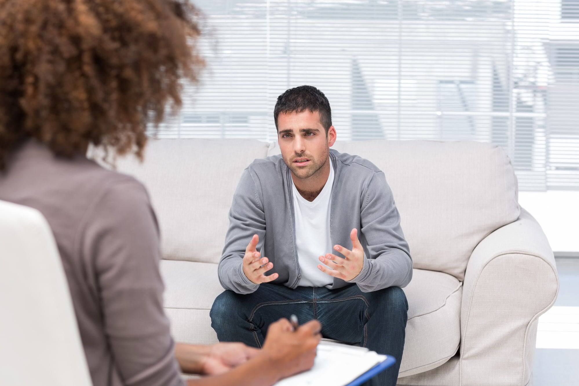 a person with bipolar disorder and substance abuse learning about treatment programs to address their mental health concerns at Transformations Mending Fences