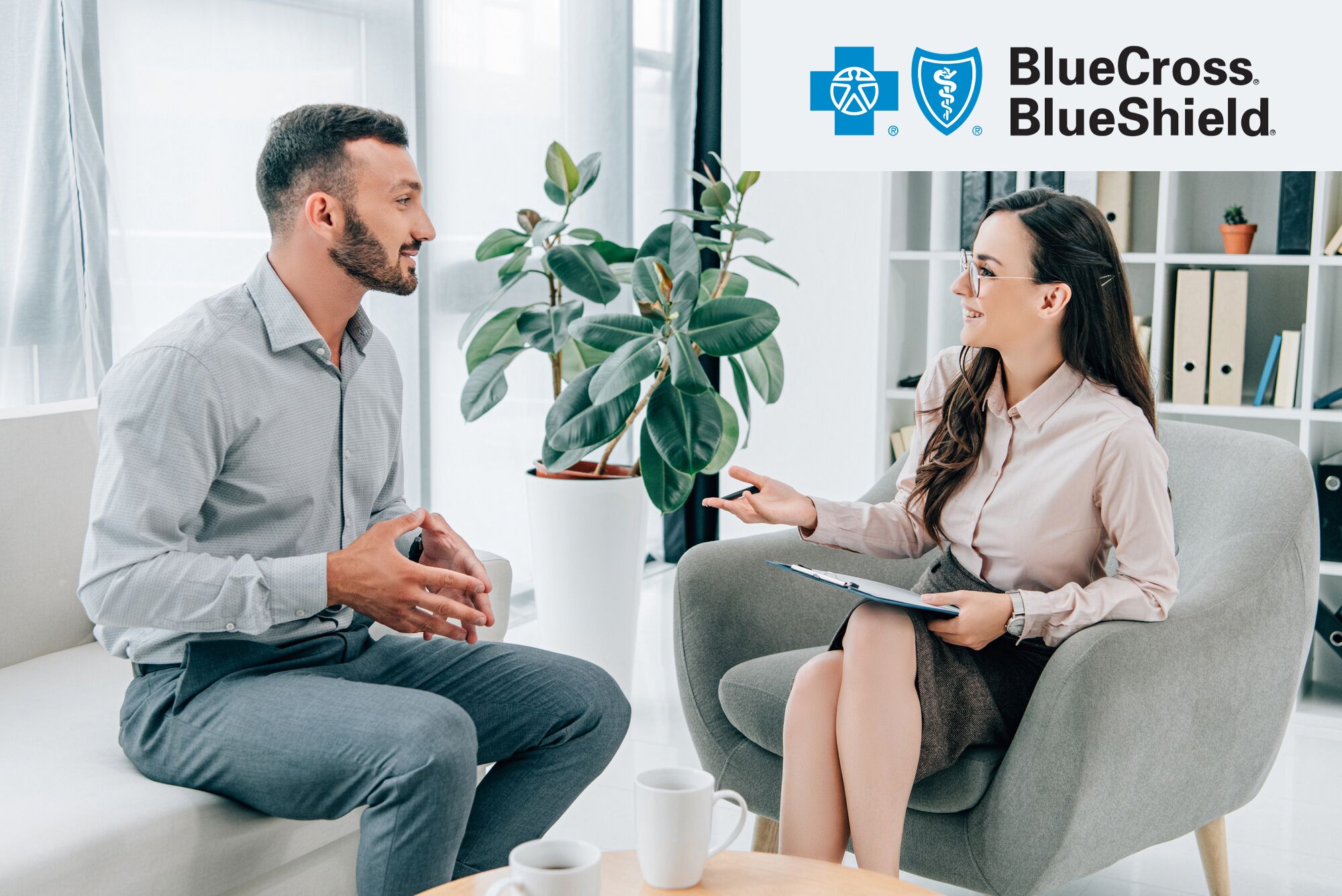 therapist discussing BlueCross BlueShield Insurance with a patient